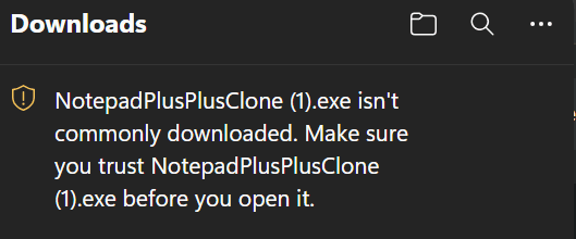 Microsoft Edge Downloads panel stating that NotepadPlusPlusClone (1).exe is not commonly downloaded.